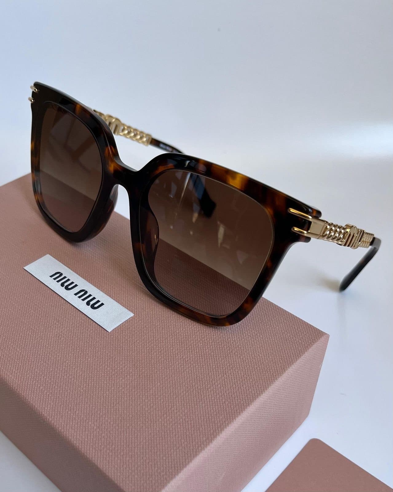 MIU MIU HAVANA SUNGLASSES - Image 1